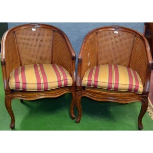 A Pair of Rattan and Mahogany Club Chairs