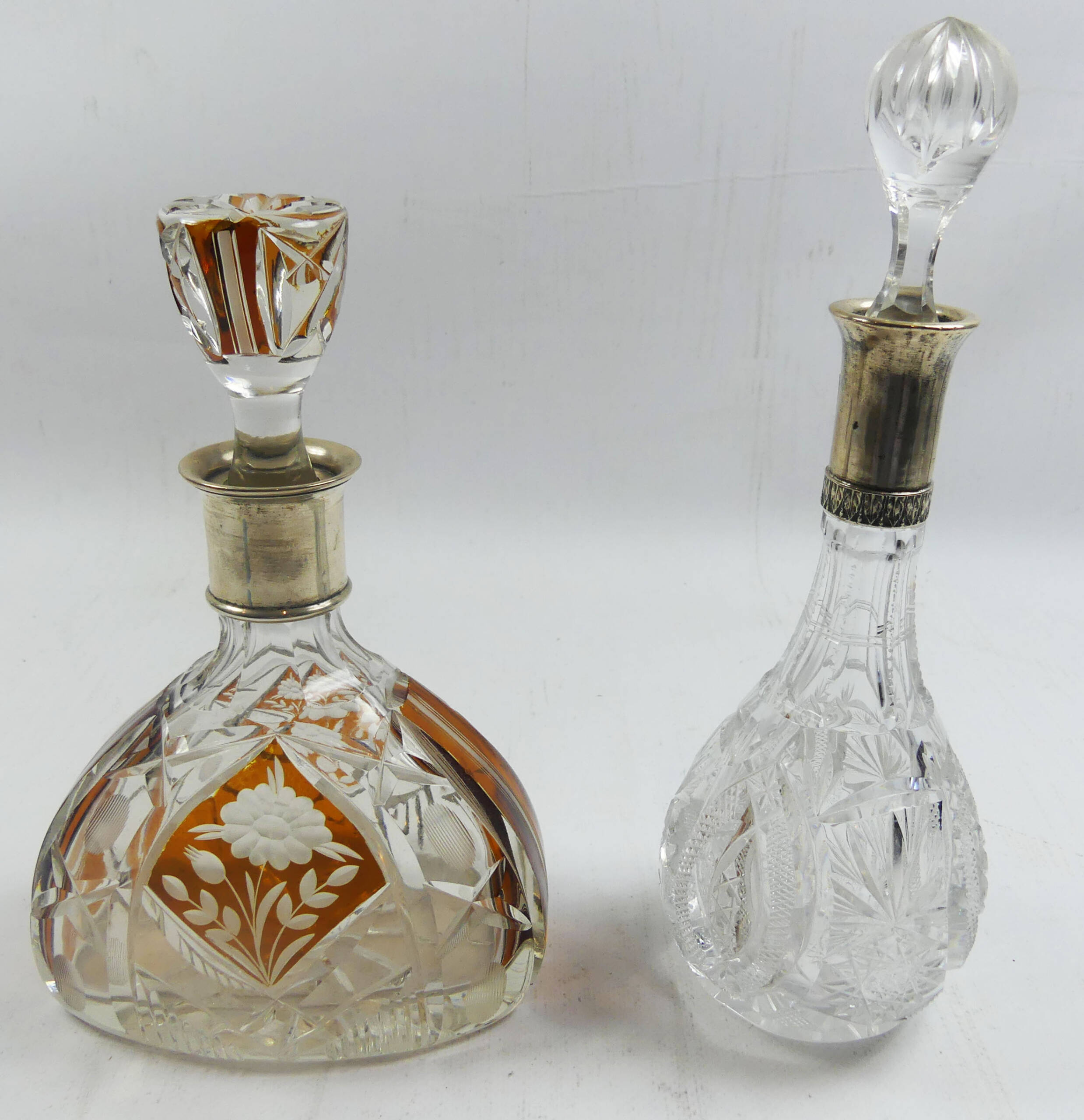Two Silver Top Decanters